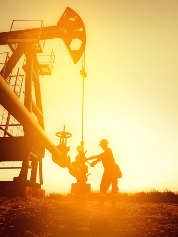 Oil,Worker,Is,Checking,The,Oil,Pump,On,The,Sunset